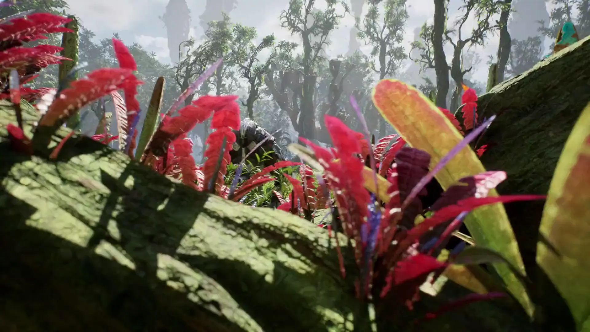 Ventra gameplay: a slow camera push through dense alien jungle towards an armoured figure.